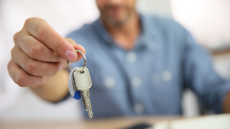 img-key-access-program Man Holding Keys